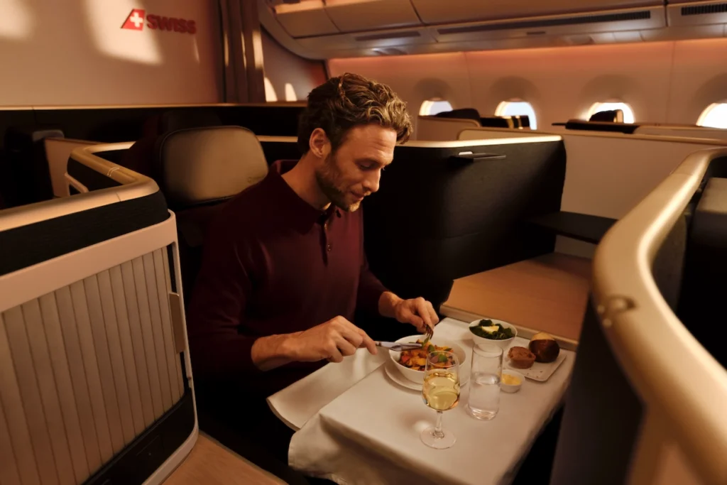 Inflight meal service inside the SWISS Business class cabin