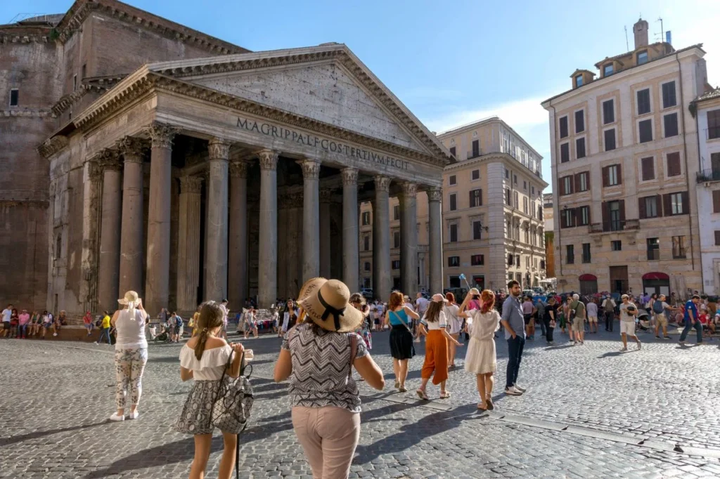 Roman Pantheon temple fronting a crowded cobblestone piazza