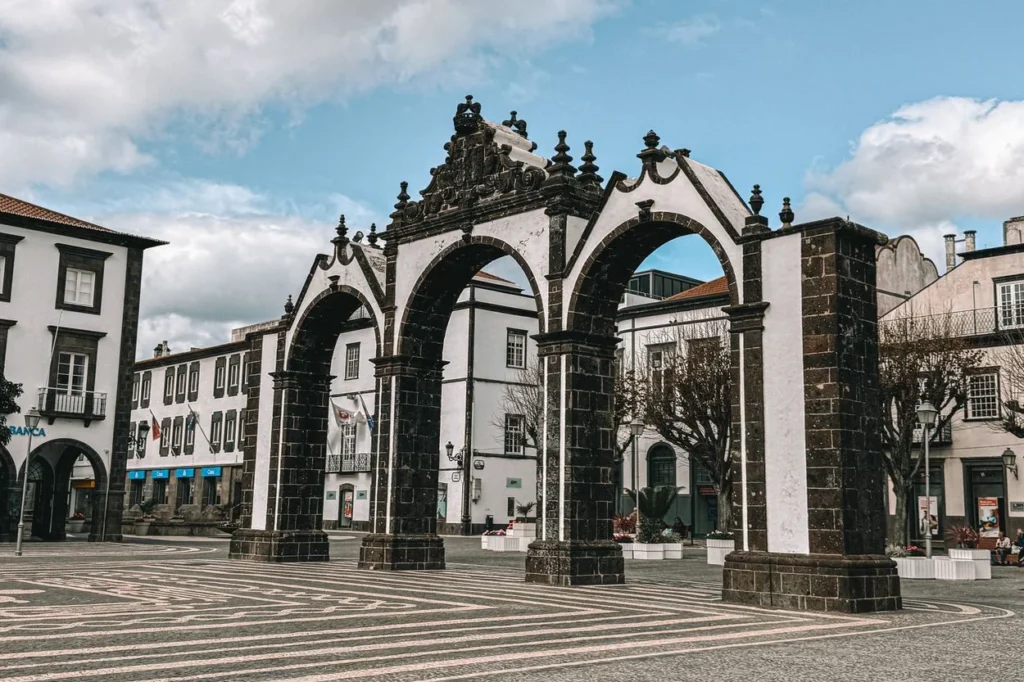 Three historic stone arches of Portas da Cidade in Ponta Delgada square