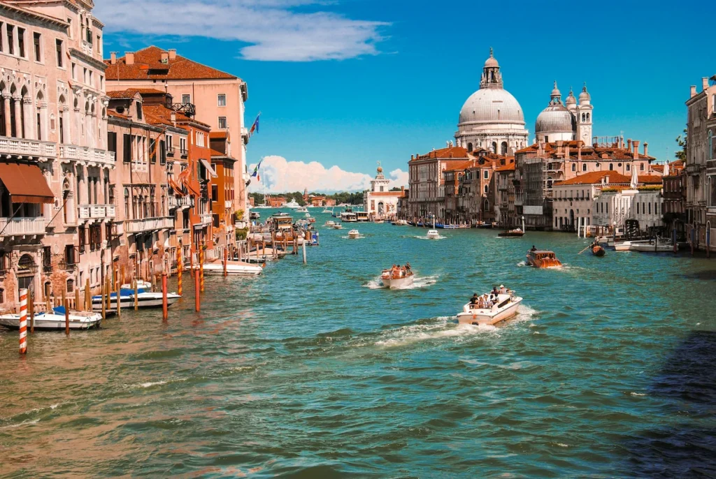 Grand Canal in Venice lined with historic buildings leading to the Santa Maria della Salute church