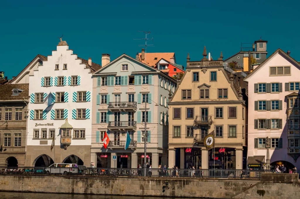 Colorful old guildhall buildings along the Limmat riverfront in Zurich