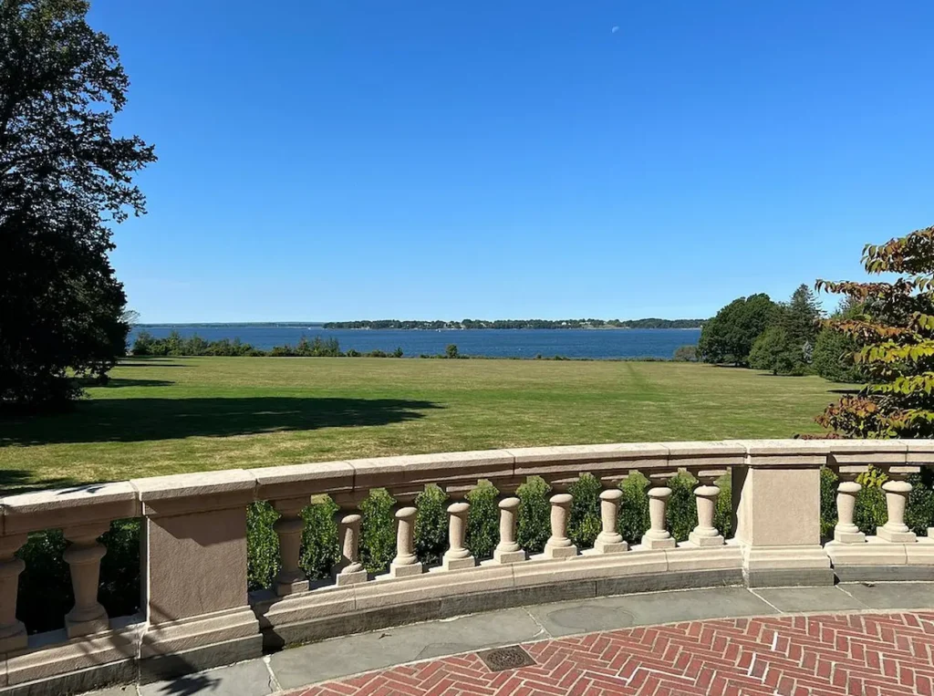 Stone terrace overlooking the Great Lawn and Narragansett Bay at Blithewold Mansion, Gardens & Arboretum