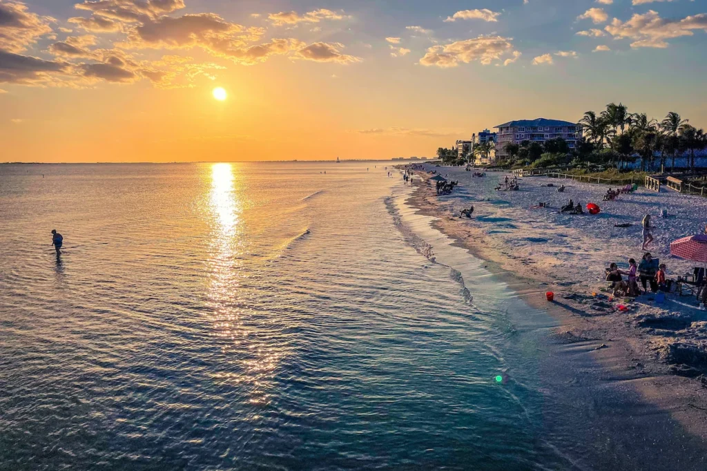 A fiery pink and orange sunset over the Fort Myers Beach coastline