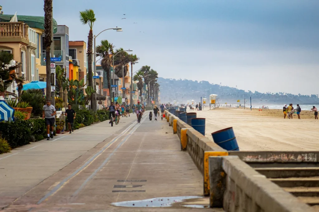 Mission Beach boardwalk running alongside the beach in San Diego