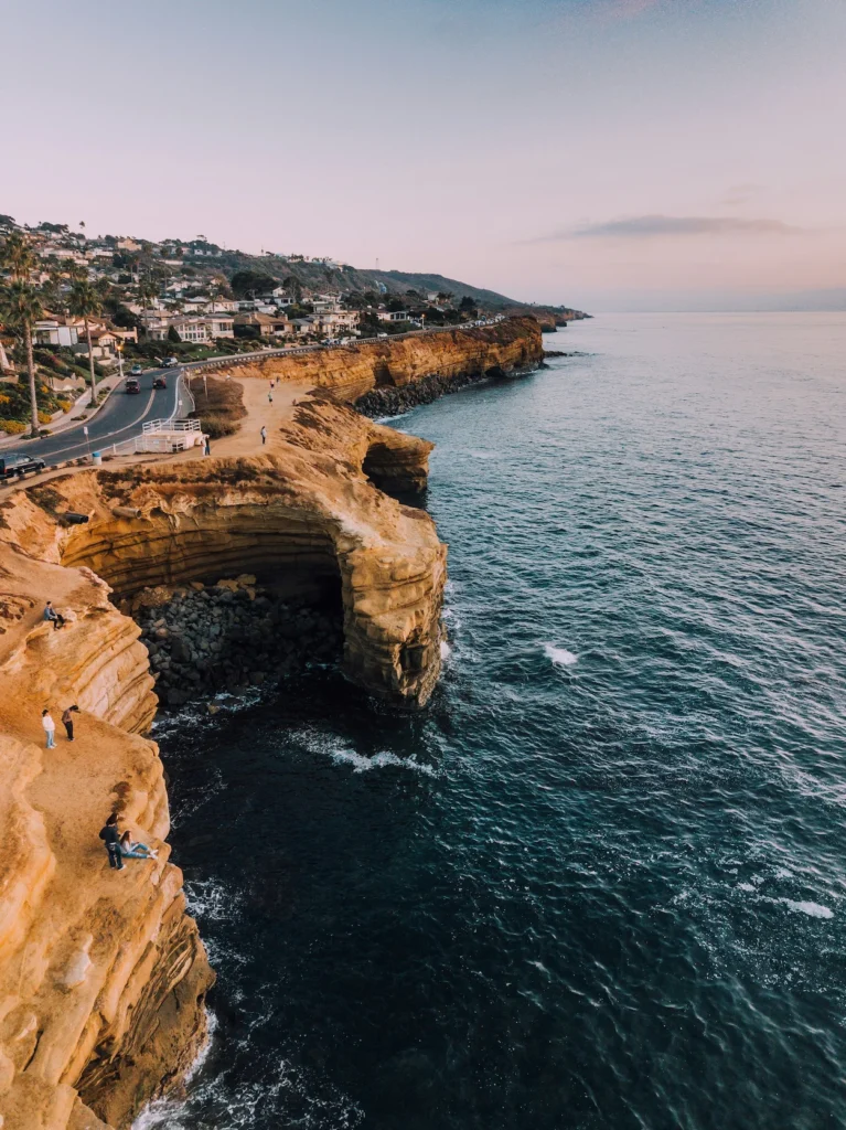 Ocean waves breaking against the rocky Sunset Cliffs in San Diego