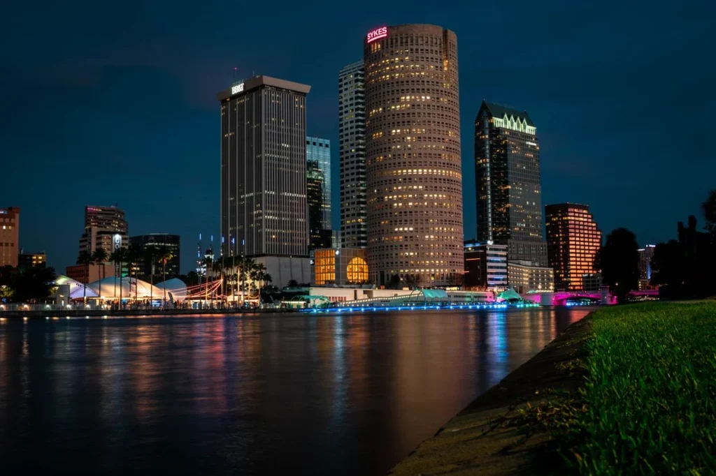 Tampa skyline and Riverwalk illuminated at night along the Hillsborough River