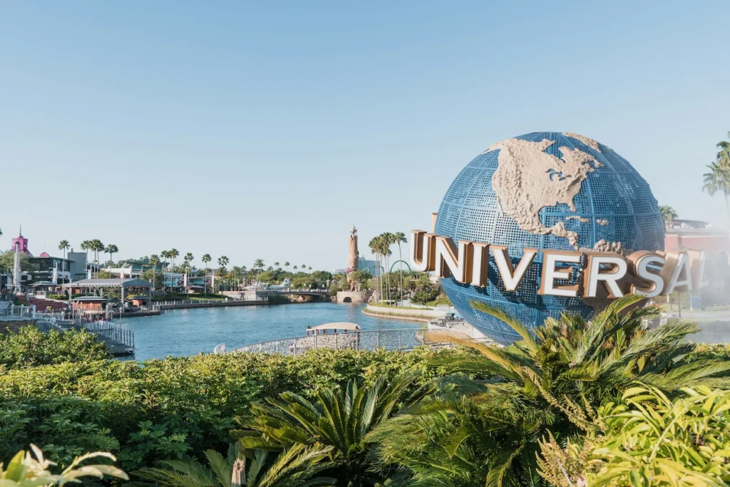 The iconic rotating Universal Studios globe sign over the water channel in Orlando, Florida