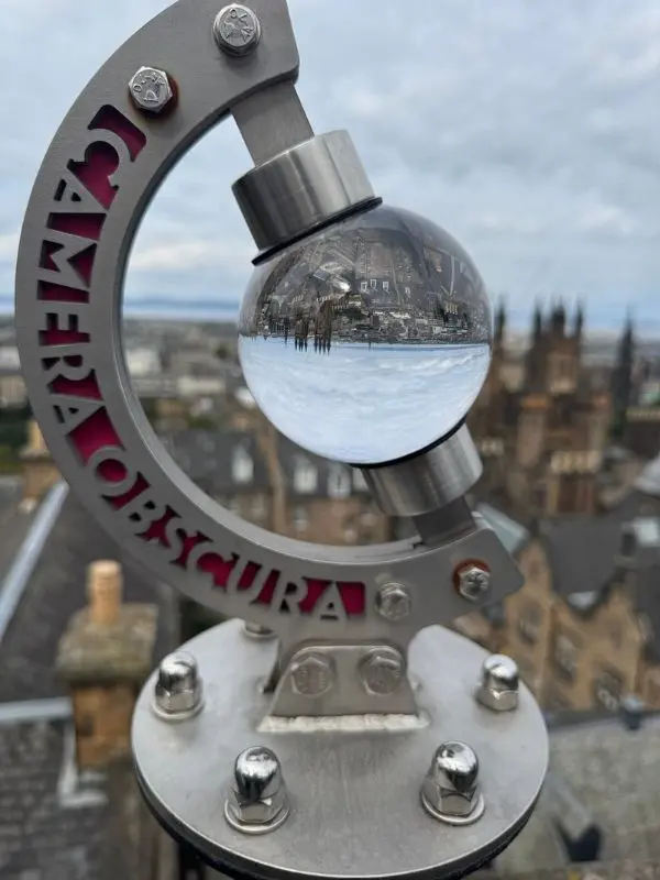 A glass sphere showing an upside-down city view at Camera Obscura.