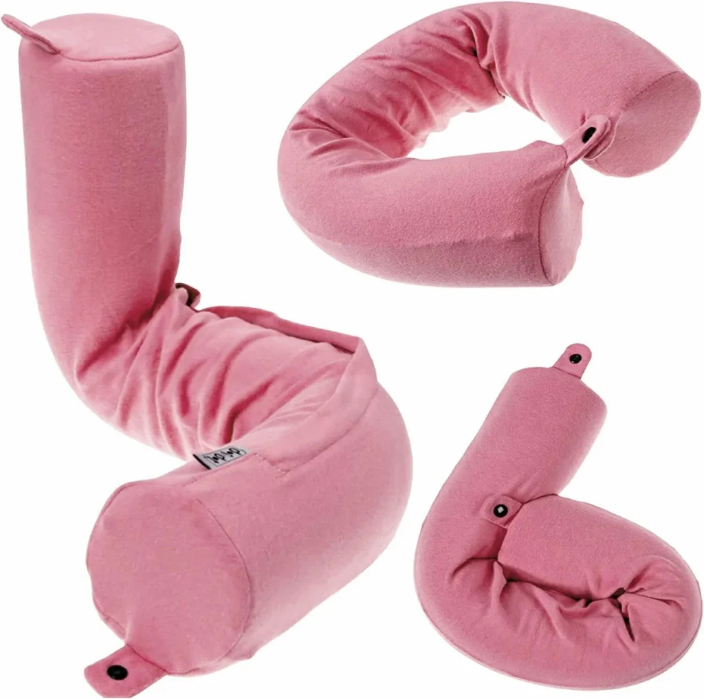 Pink memory foam travel pillow shown as a bolster, U-shaped cushion, and support wrap
