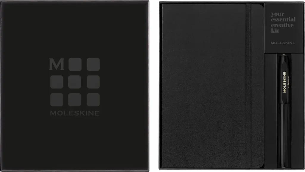 Open black Moleskine gift box with a hardbound notebook and Moleskine x Kaweco rollerball pen