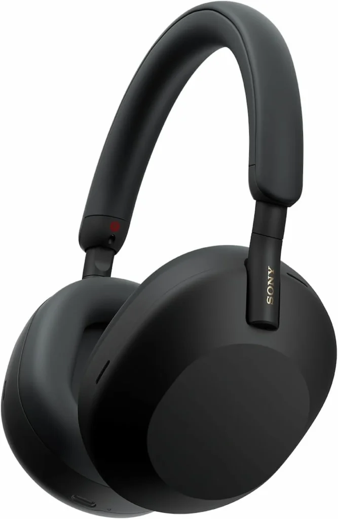 Side view of black Sony WH-1000XM5 wireless over-ear headphones on a white background