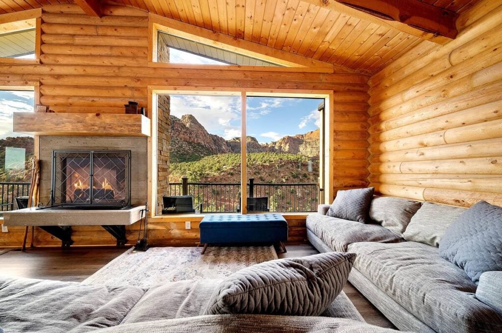 Cozy up by the fireplace while enjoying these stunning views! This cabin offers the perfect blend of rustic charm and breathtaking scenery