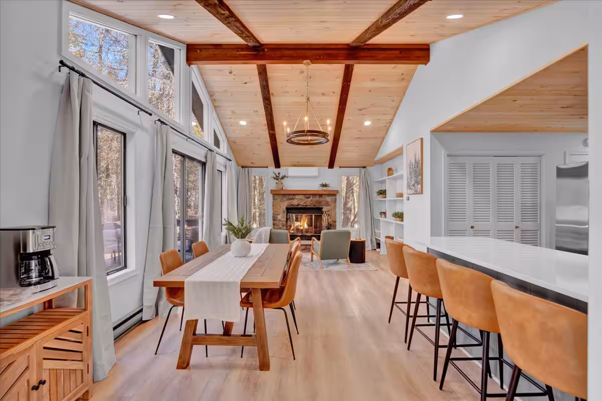 Check out the stunning decor inside Emerald Pines Cabin! The open space and warm wood tones create the perfect cozy atmosphere for your fall getaway