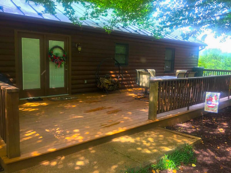 Cozy cabin vibes with a spacious deck, perfect for relaxing outdoors—one of the best fall foliage Airbnbs in the US!