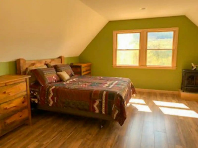 Cozy vibes inside! The big window lets in plenty of light, and the warm wood colors make it feel like home
