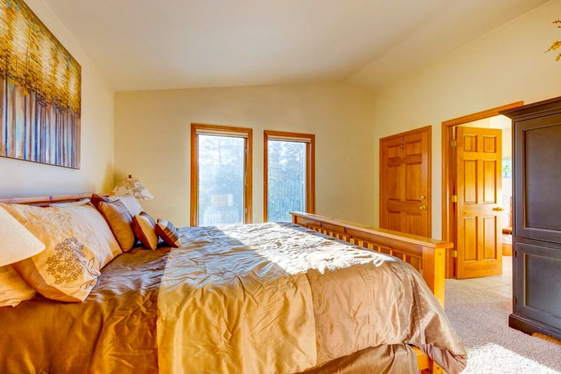 Start your day with warm sunlight and scenic views from this inviting and cozy bedroom, a perfect escape