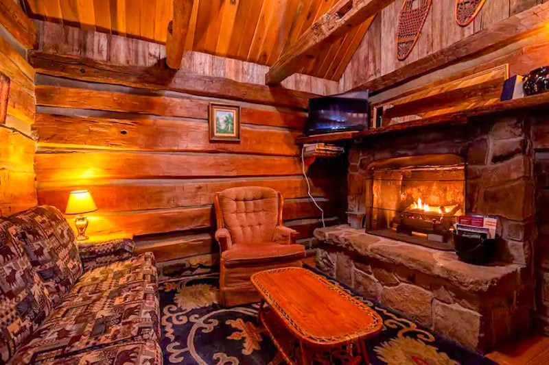 Cozy up by the fire in this rustic cabin—perfect for chilling after a day of exploring