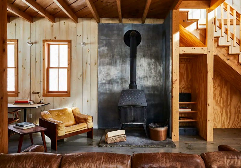Cozy cabin in Brushland's Owl Nest with wood walls and rustic decor.