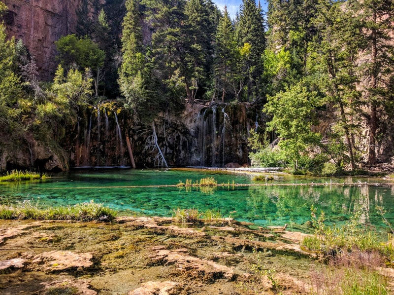 Hanging Lake leads to a stunning turquoise lake with waterfalls and requires an advance permit.