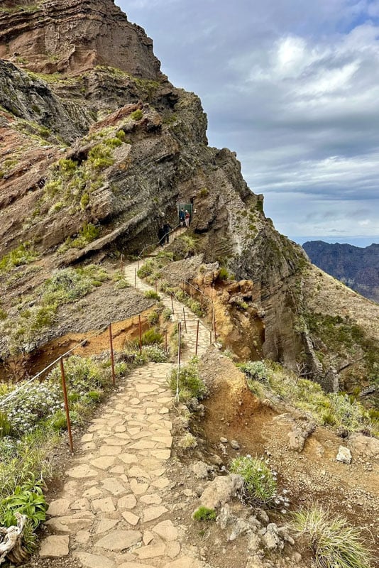 The Pico hike in Madeira offers rugged terrain and stunning views from Pico do Arieiro to Pico Ruivo.
