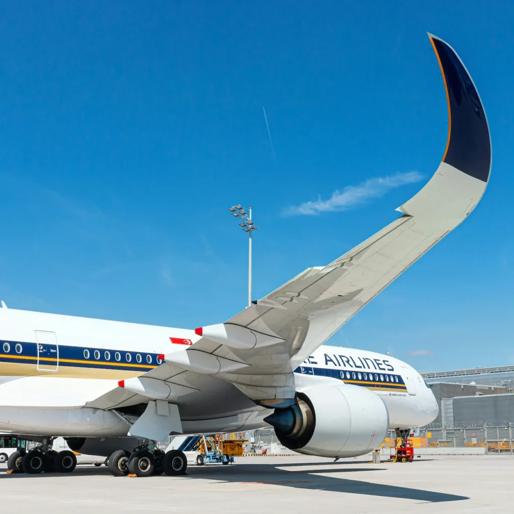 Curved winglet and engine of a Singapore Airlines Airbus A350 on an airport ramp