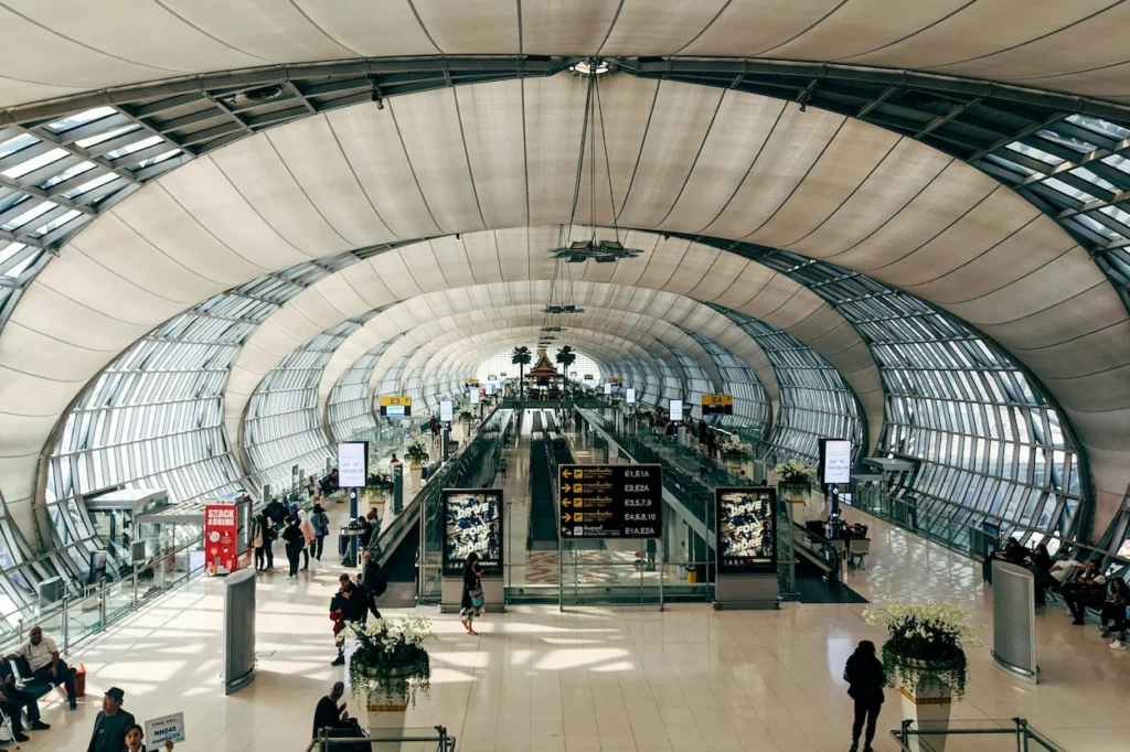 Vaulted arch ceiling and concourse gates of Suvarnabhumi Airport terminal in Bangkok