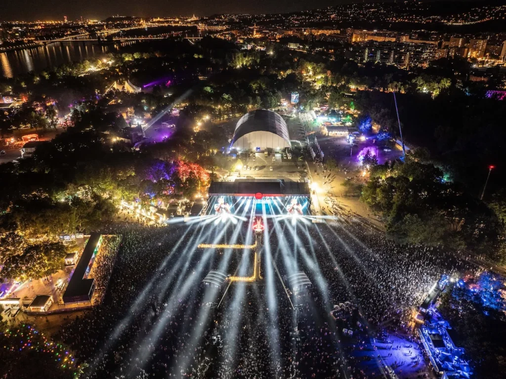 Aerial night view of the illuminated Sziget Festival main stage and crowd