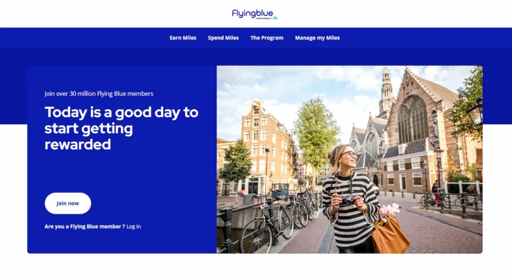 Flying Blue website banner showing a traveler standing by an Amsterdam canal