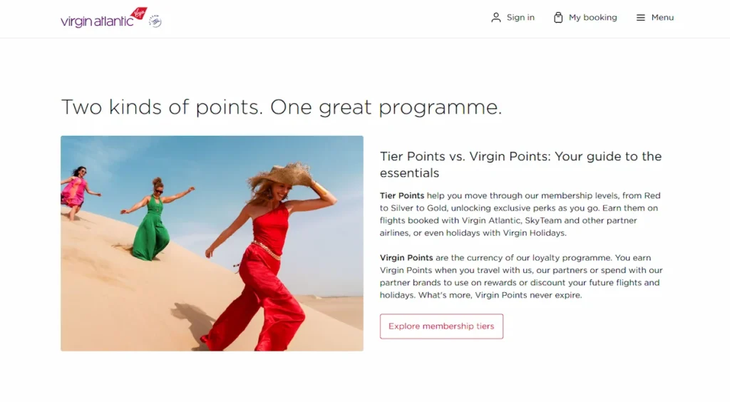Virgin Atlantic flying club website banner showing three women walking down a sand dune
