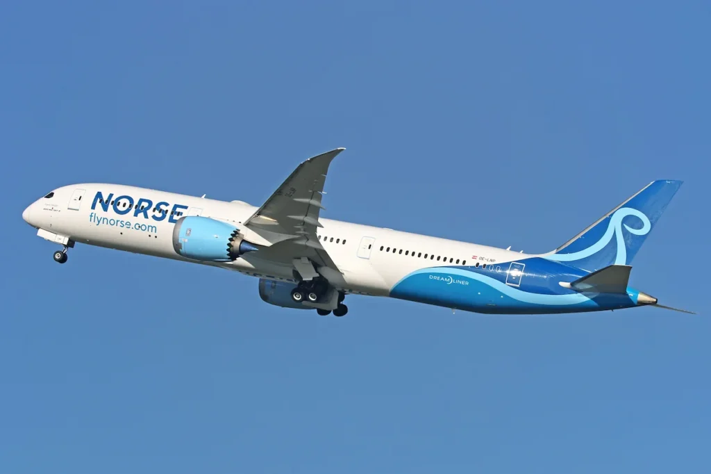 Norse Atlantic Airways Boeing 787 Dreamliner flying through a clear blue sky