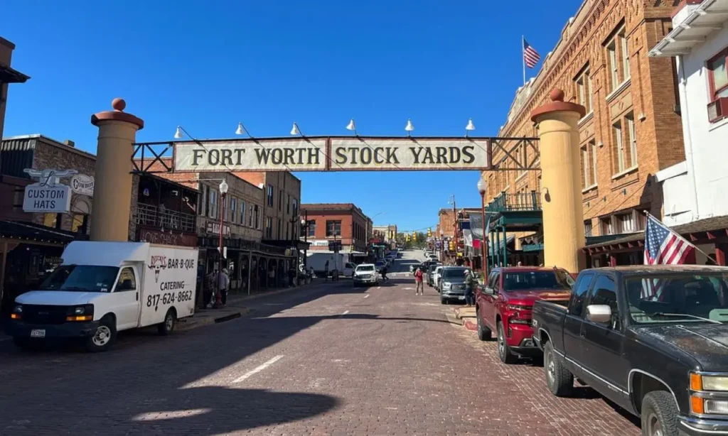 A sign spans the street entrance to Fort Worth Stockyards.