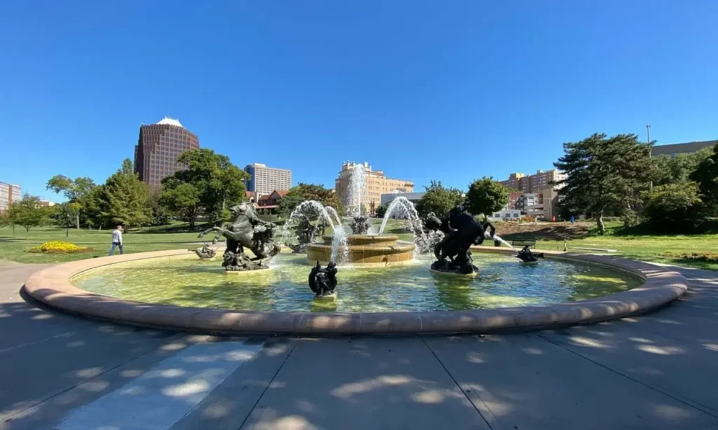 Fountain with statues and surrounding park at The Country Club Plaza.