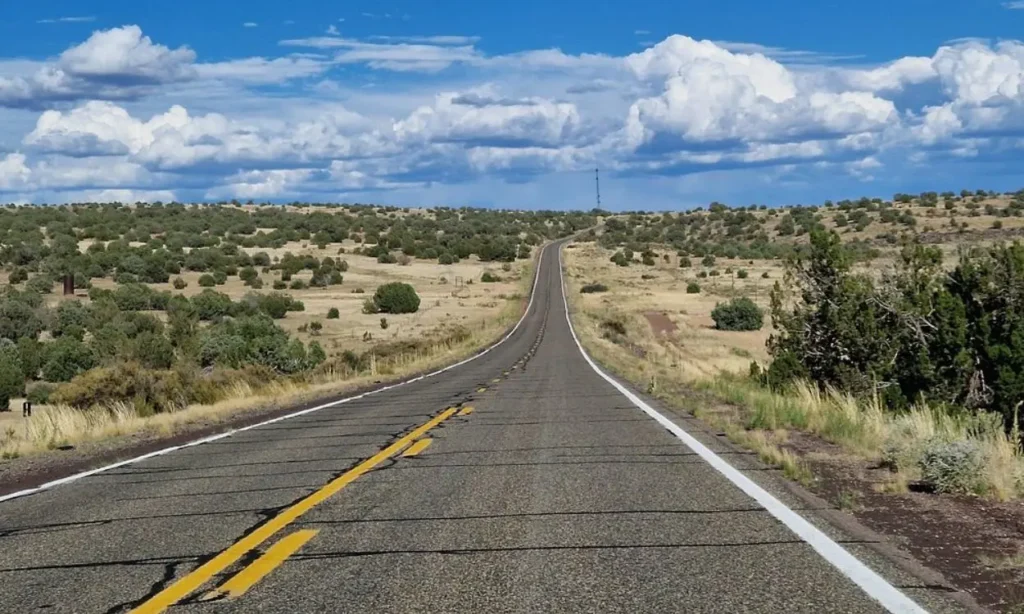 A long open highway stretches through the landscape on Route 66.