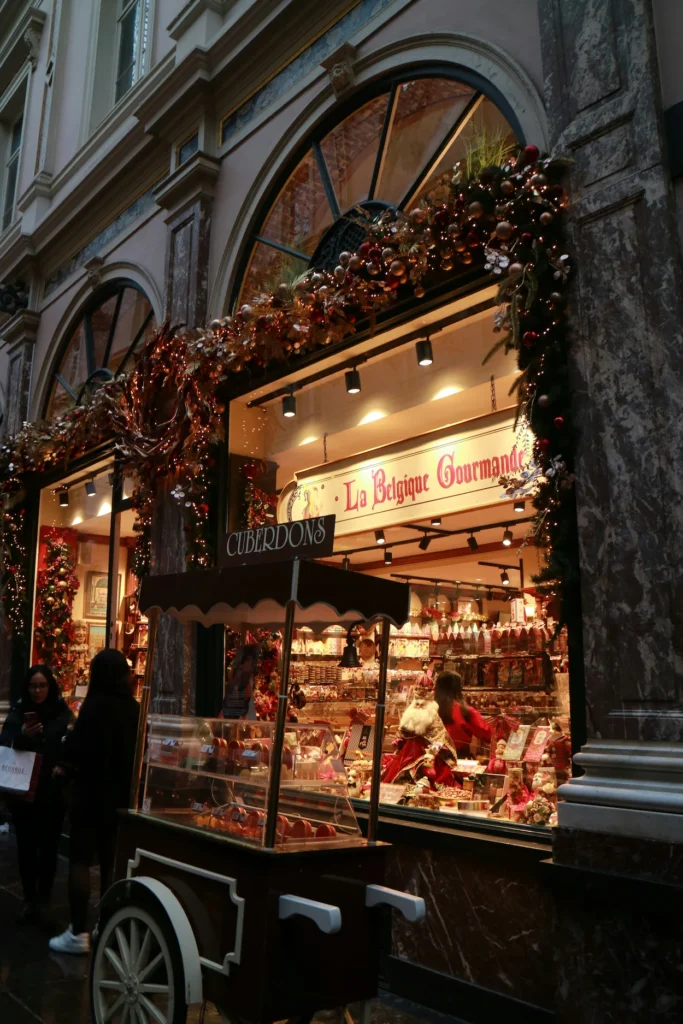 La Belgique Gourmande storefront decorated with holiday garland in Brussels, Belgium