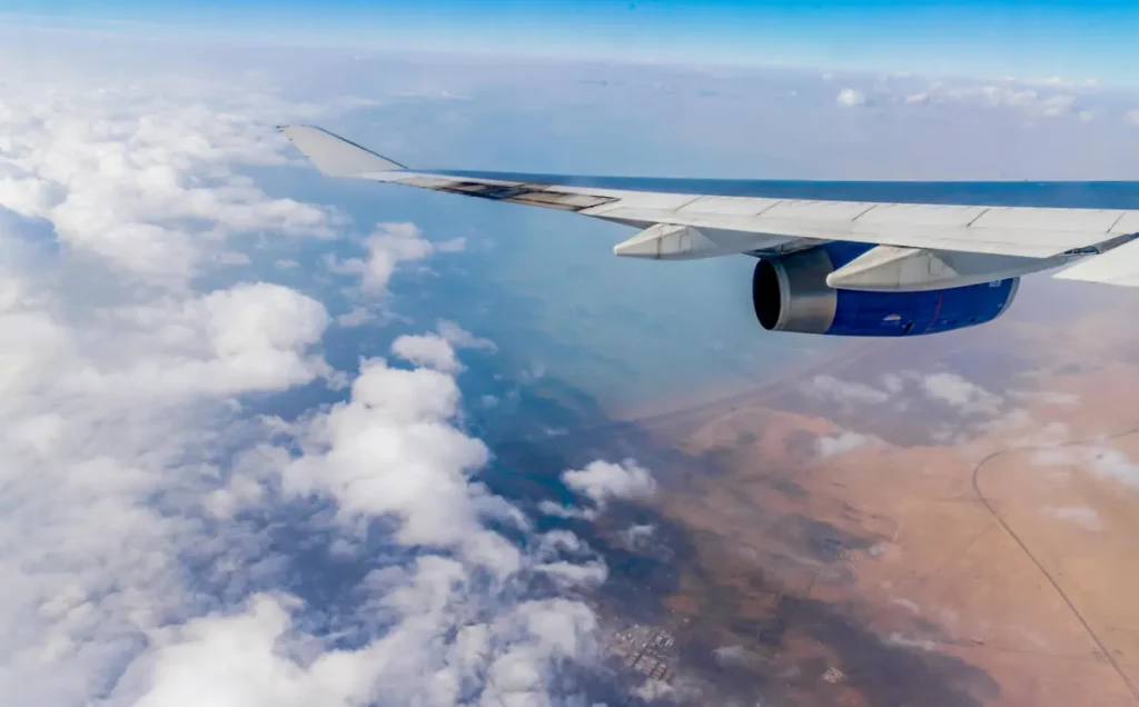 Wing view of an aircraft cruising high above