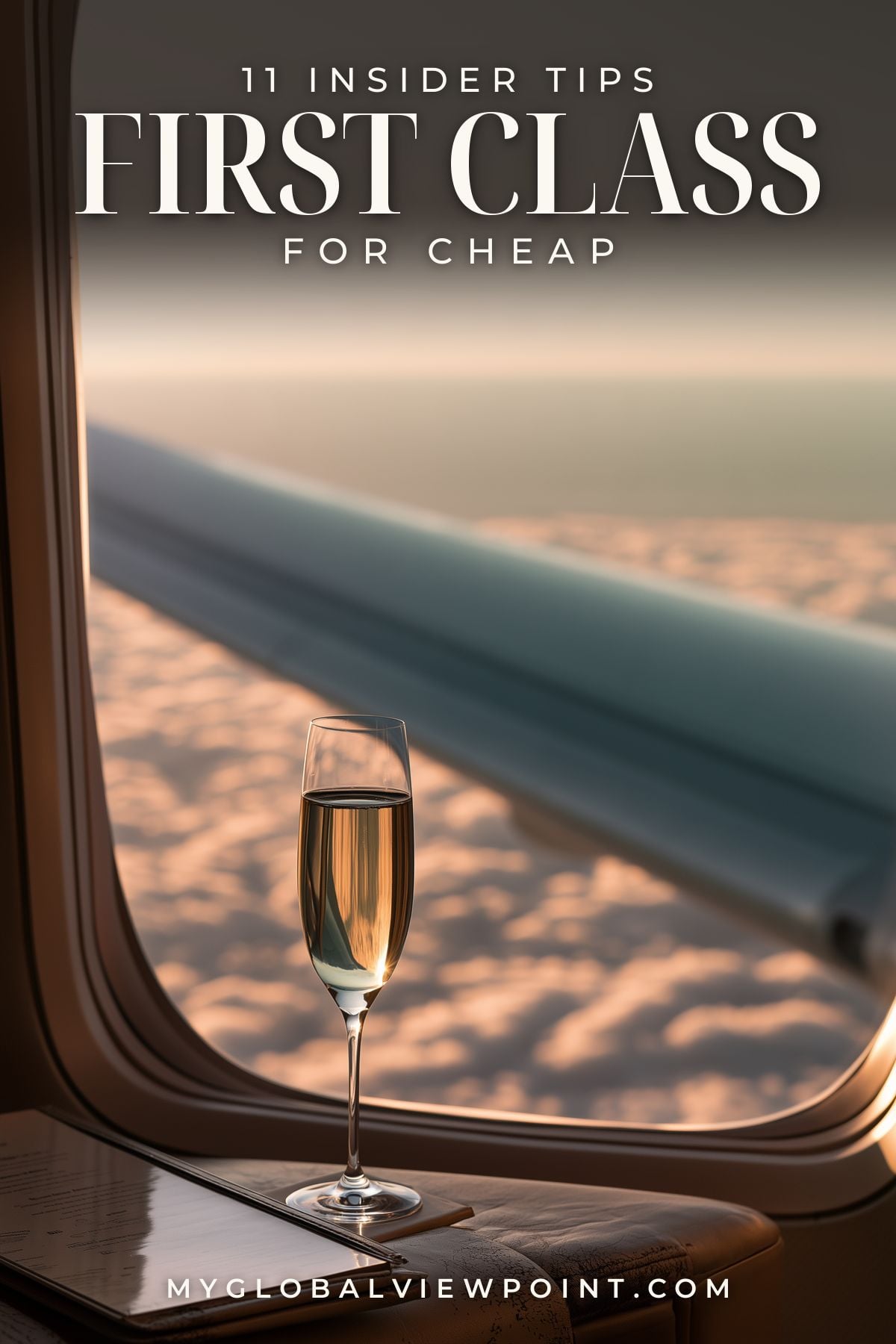 Cheap first class flights pin with a champagne glass beside an airplane window above the clouds.