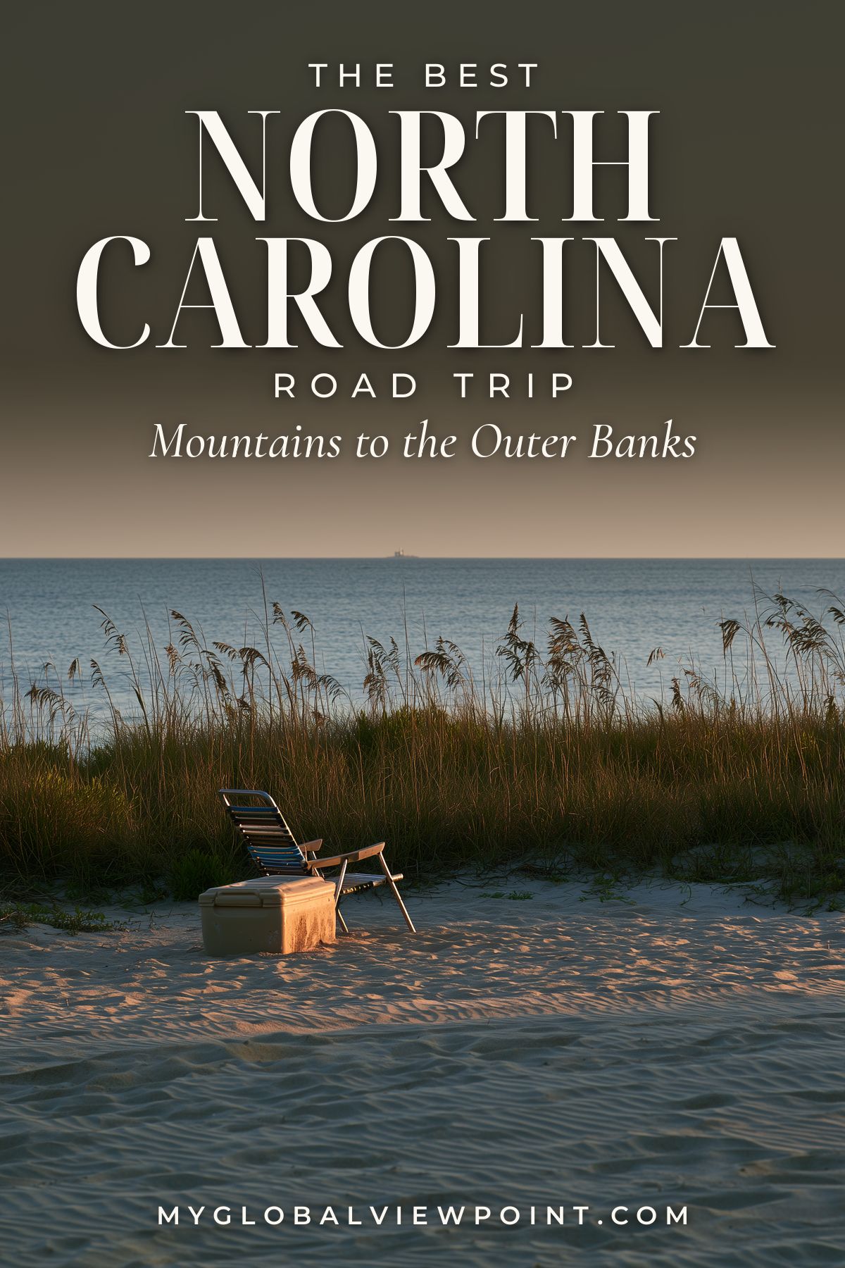 North Carolina road trip pin with a beach chair and cooler on dunes beside the ocean.