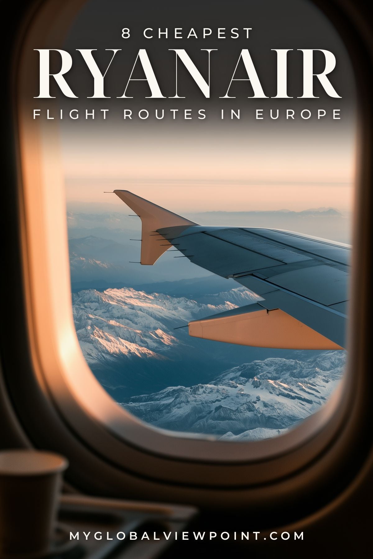Ryanair routes guide pin with an airplane-window view of a wing above snowy mountains.