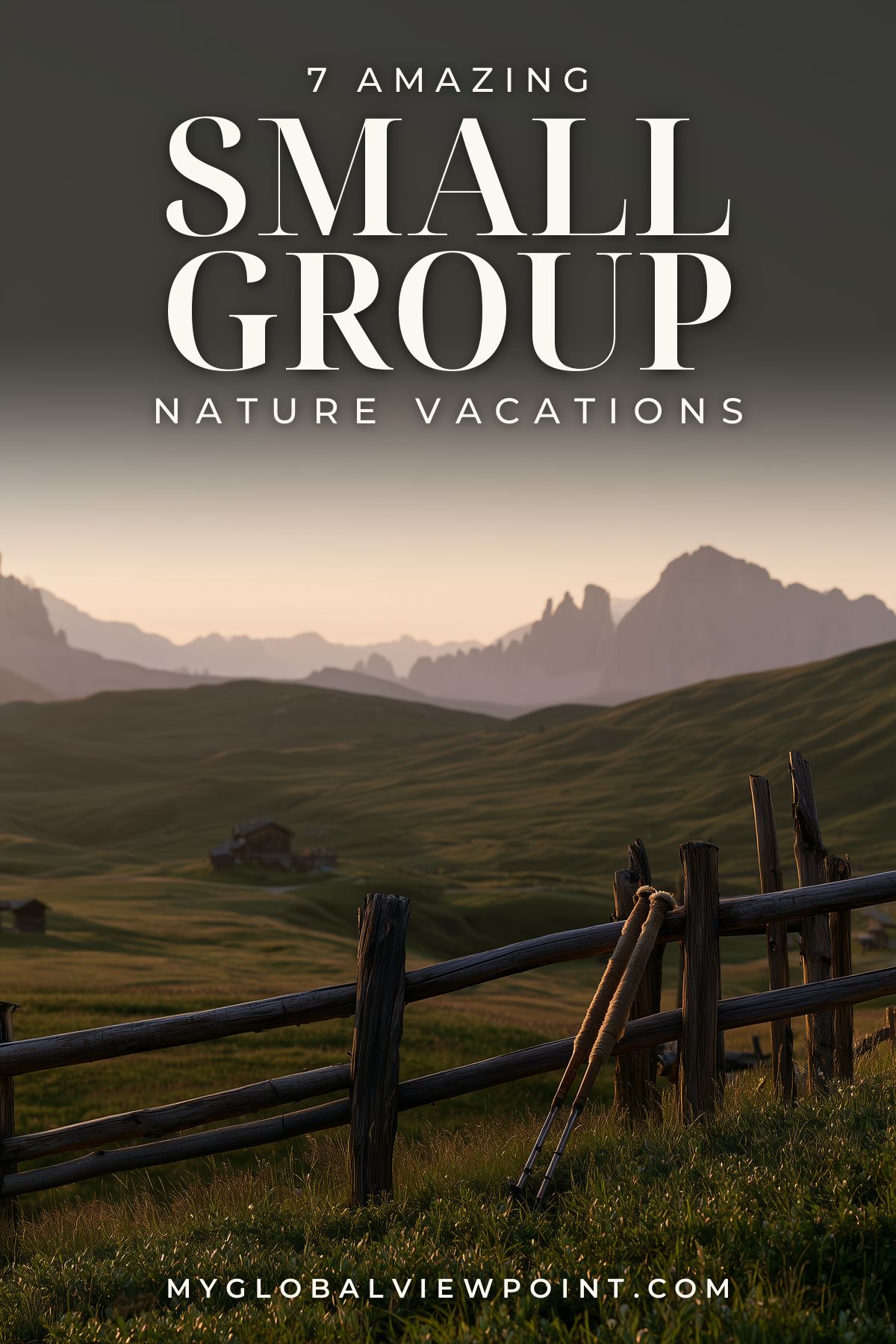 Small group nature vacations pin with walking poles beside a fence in an alpine meadow.