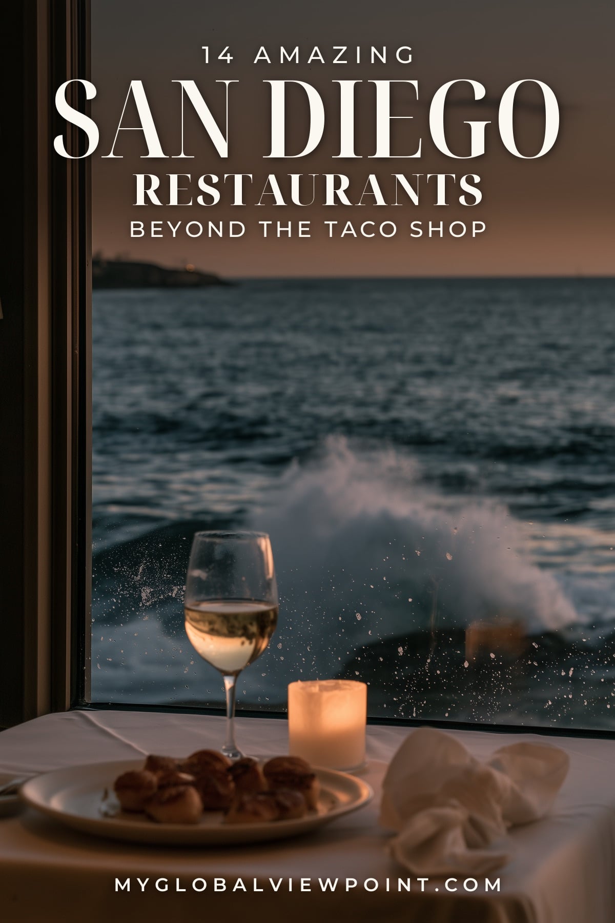 San Diego restaurant pin showing a candlelit table beside an oceanfront window as waves break outside.